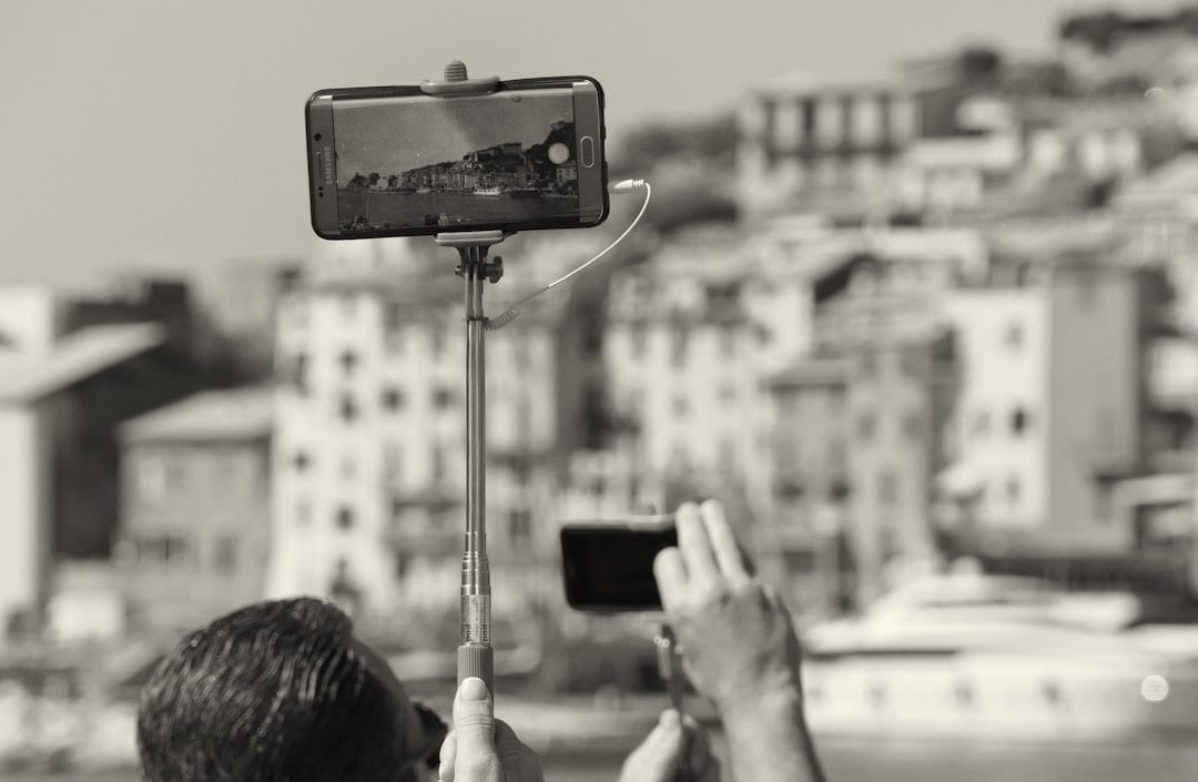 Vertical video filming setup with phone showing platform UI safe zone overlays