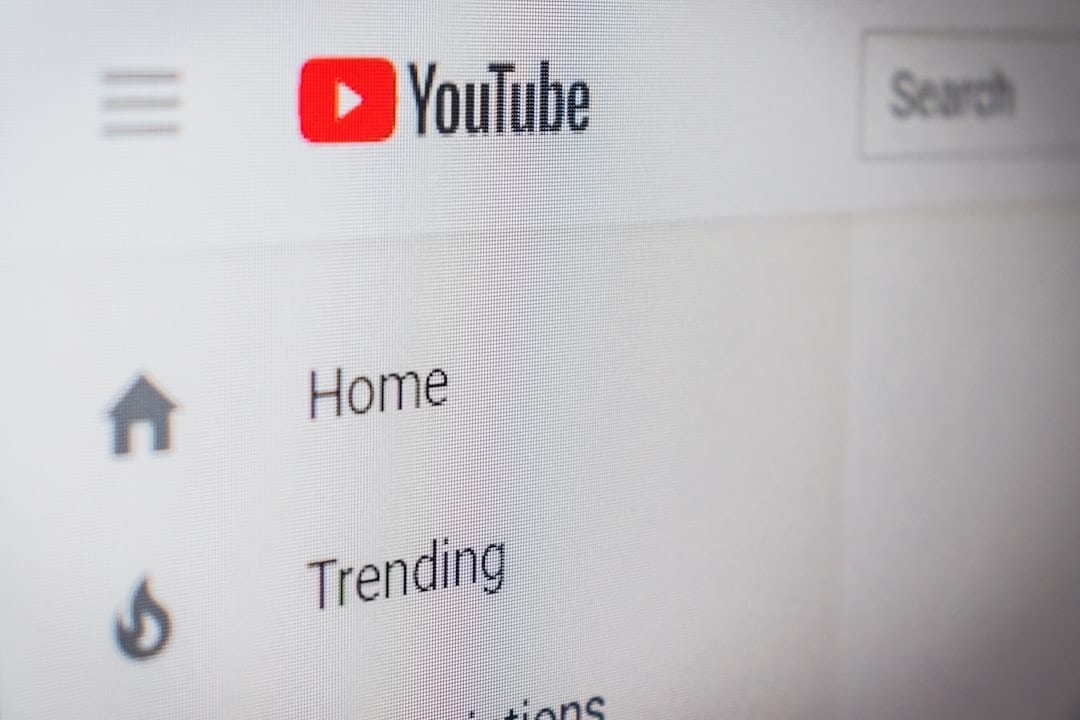 YouTube video download options displayed on a laptop screen
